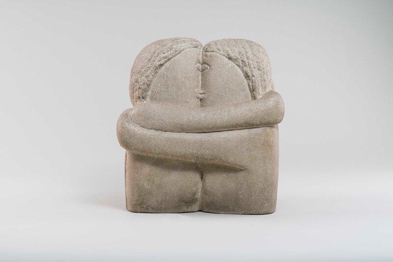 The Kiss by Constantin Brâncuși (1907–1908), a carved stone sculpture of two figures locked in an embrace